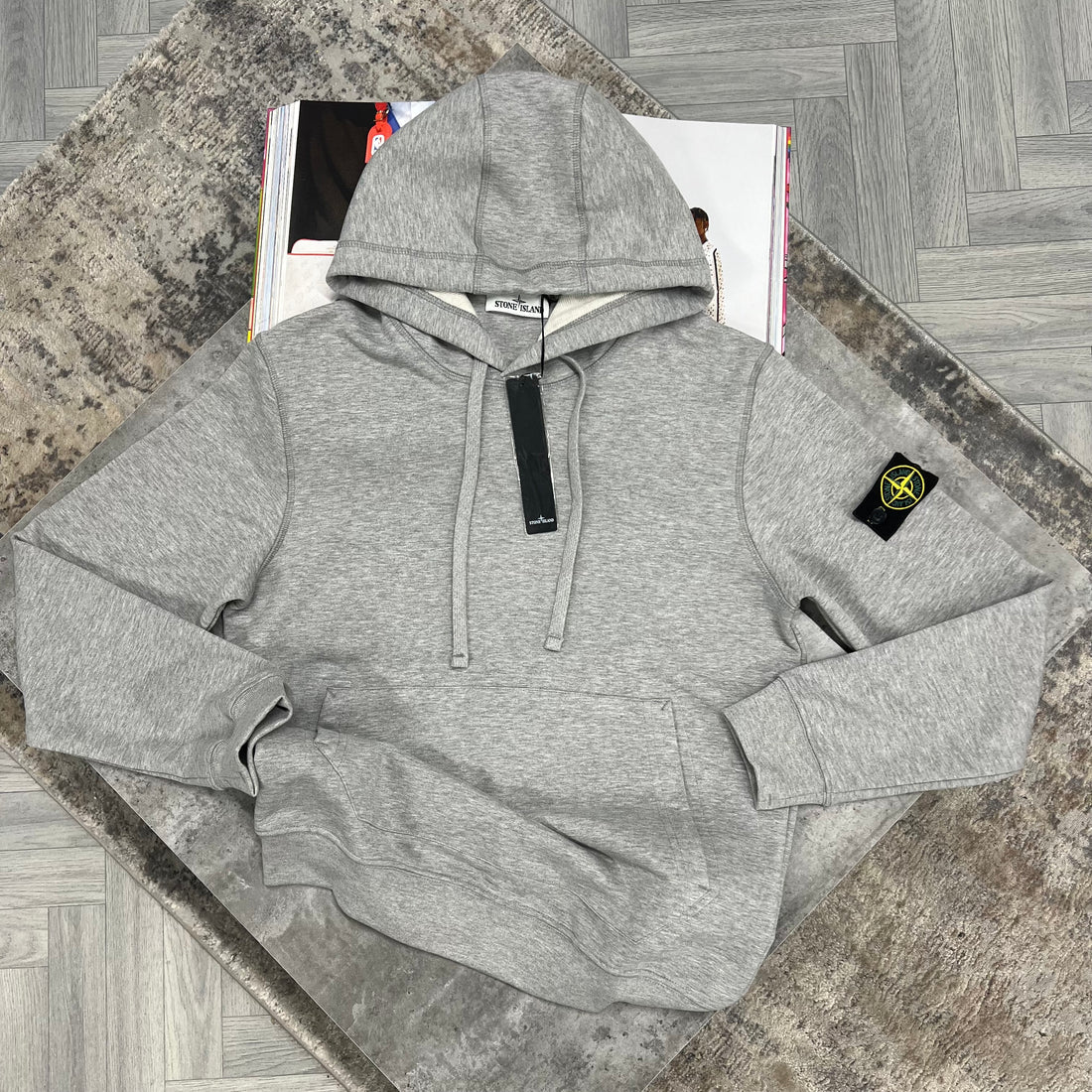 Grey hoodie with logo in the sleeve