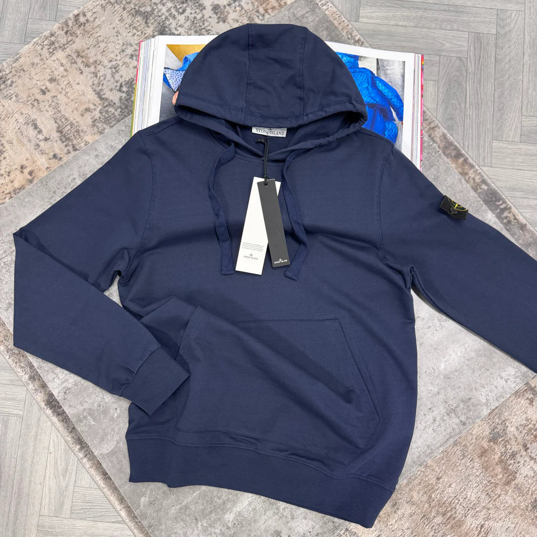 Navy hoodie with logo in the sleeve