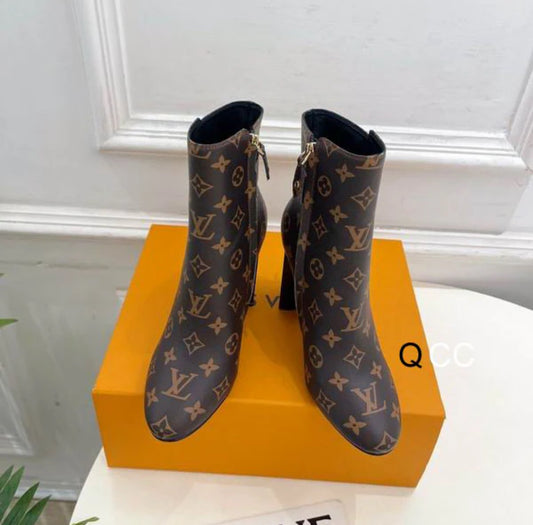 brown boots with printed logo