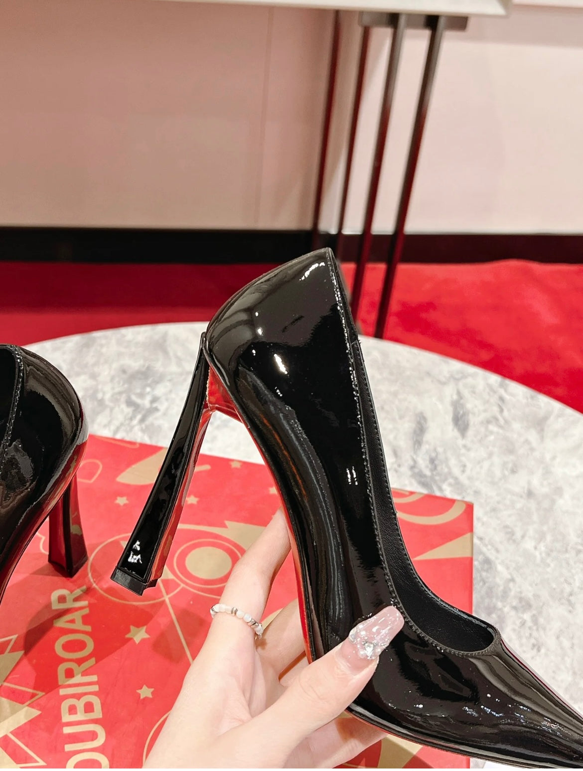 Elegant Pointed-Toe Pumps in Black with Red Sole