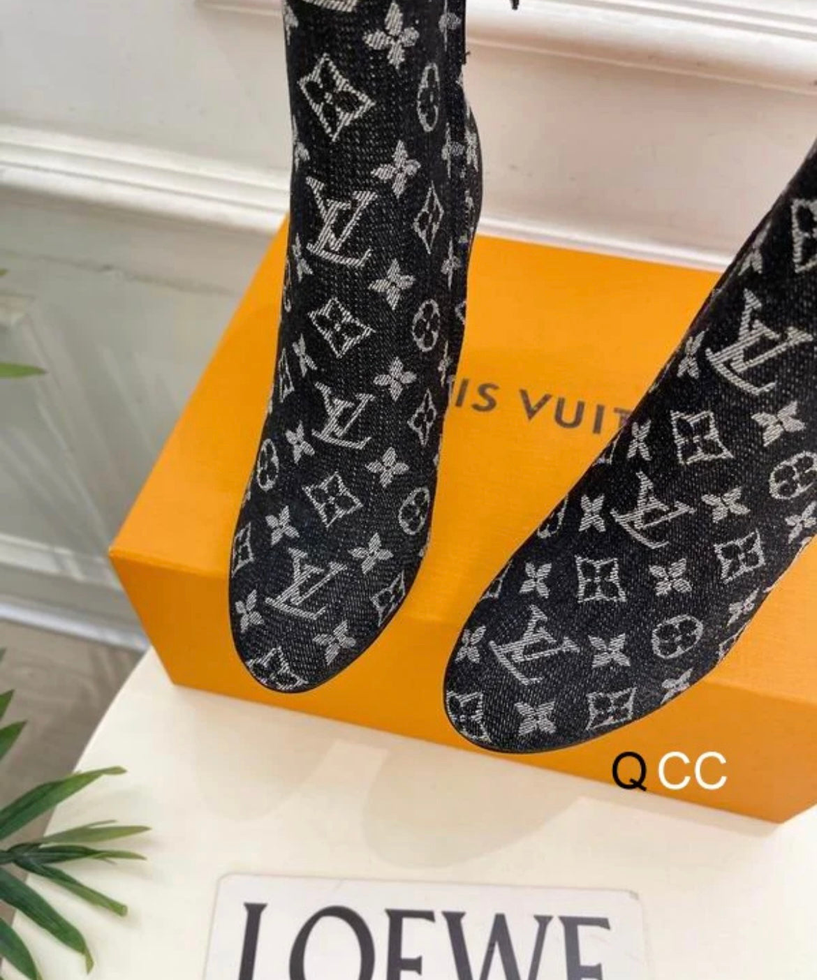 Black boots with printed logo