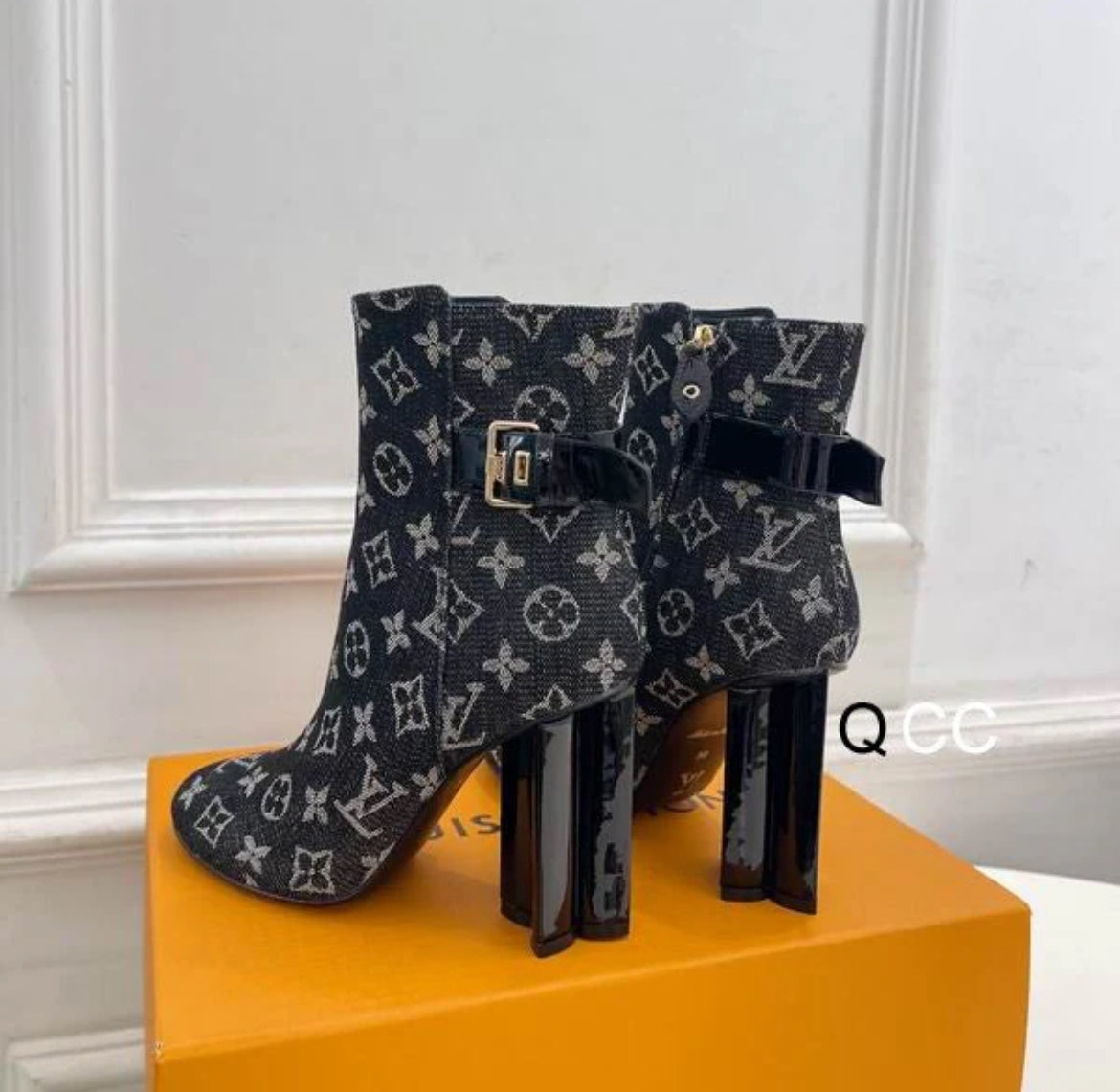 Black boots with printed logo