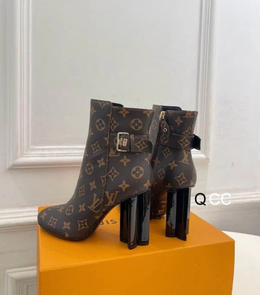 brown boots with printed logo