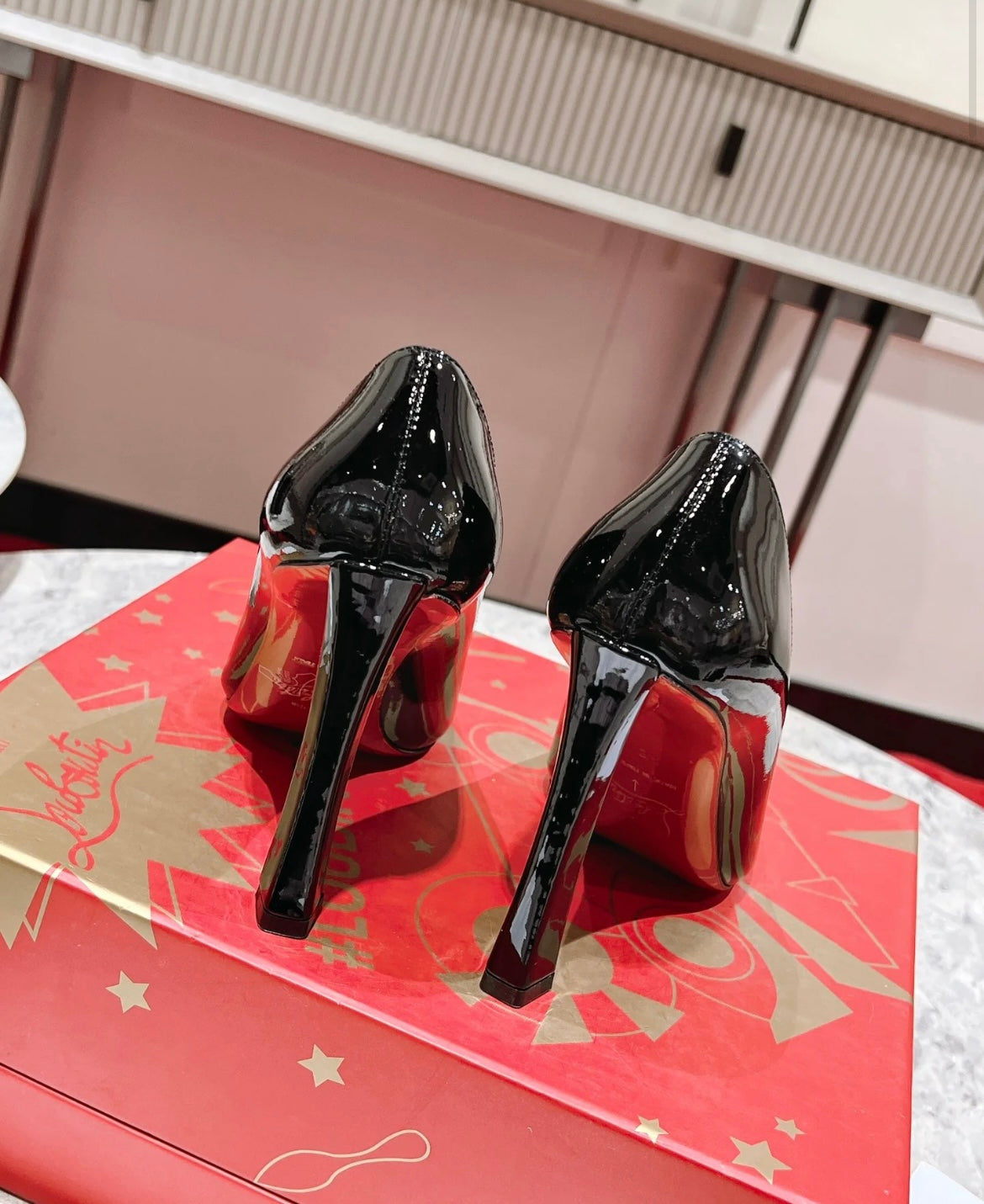 Elegant Pointed-Toe Pumps in Black with Red Sole