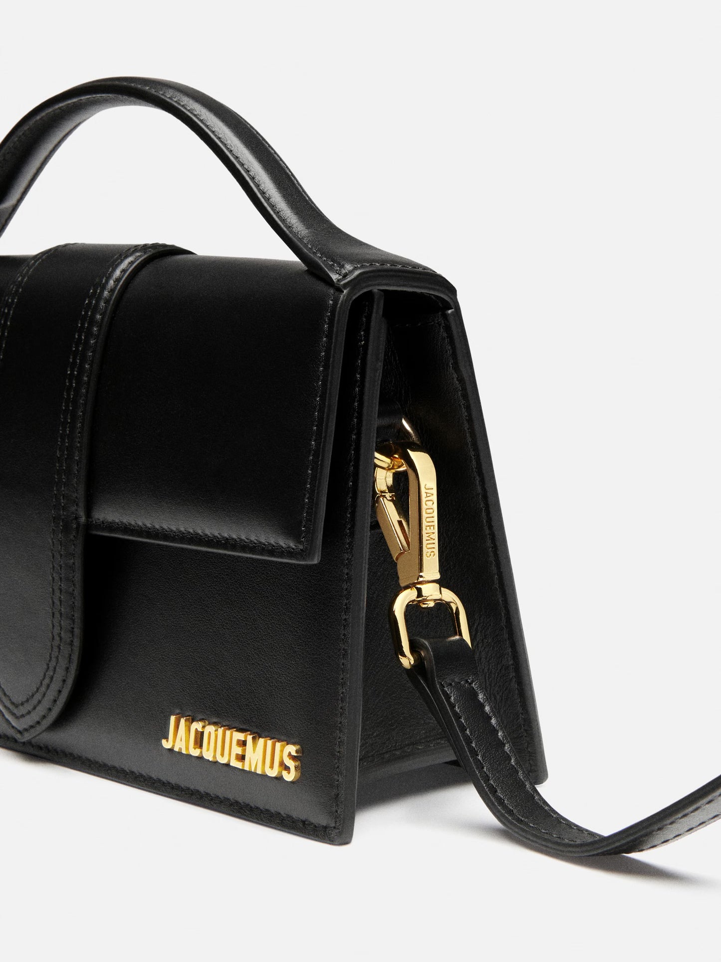 Black elegant hand bag with gold logo