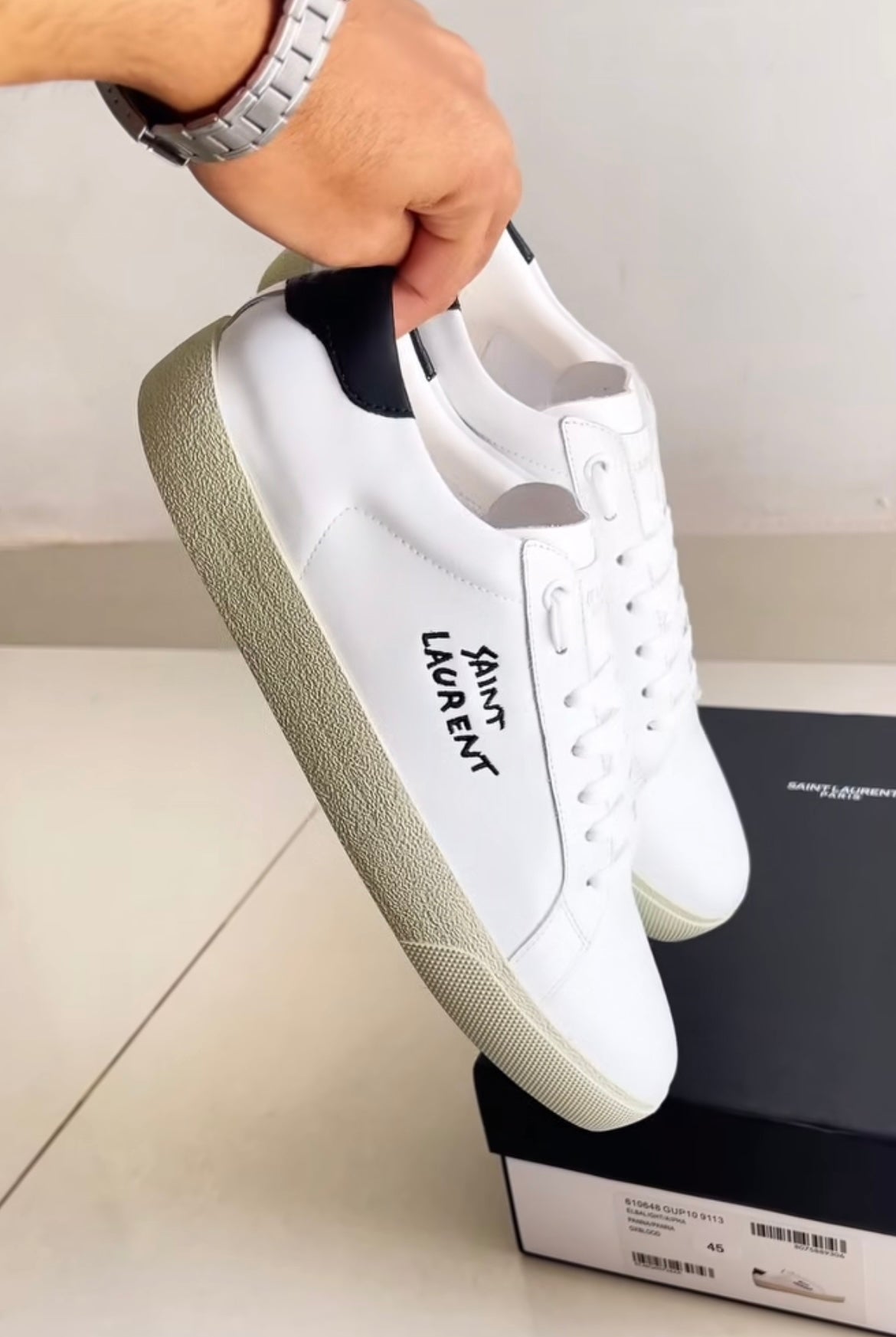 White shoes with brand logo in black