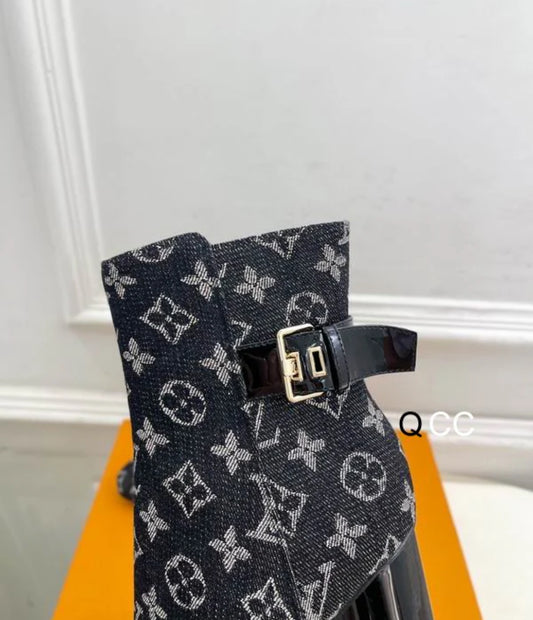 Black boots with printed logo